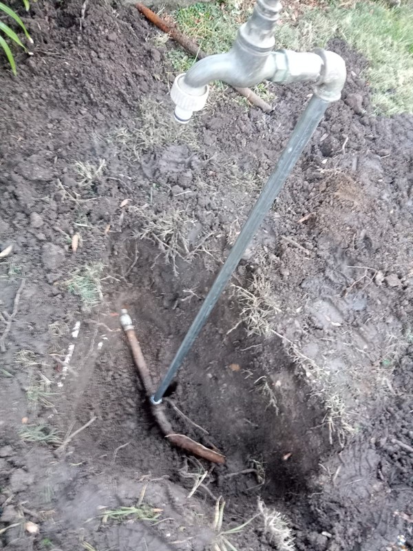 Steady leaking from burst outside pipe in Oaktree