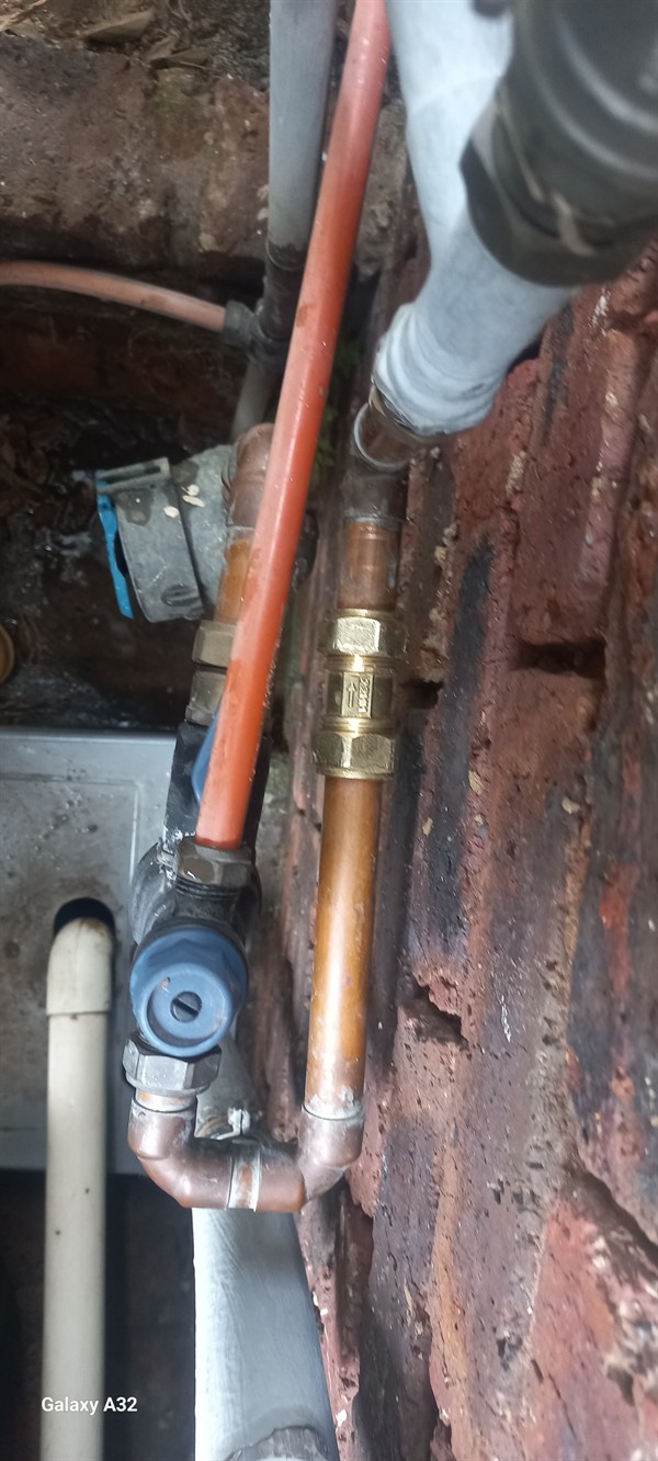 Pooling water mess from burst outside pipe in West Village