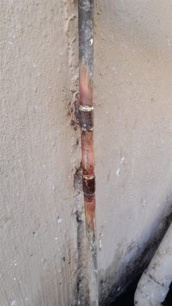 Pouring water from burst outside pipe in Windsor Mine