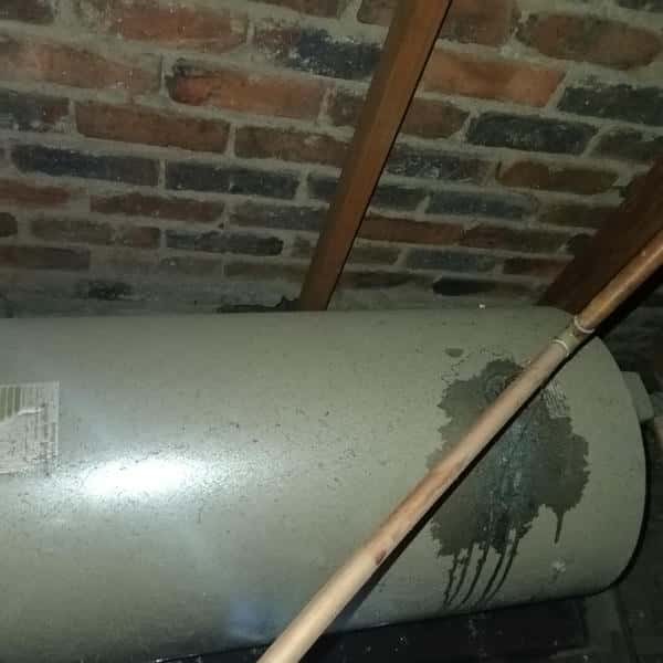 Ceiling leaking from burst pipe with visible stains in Meldene