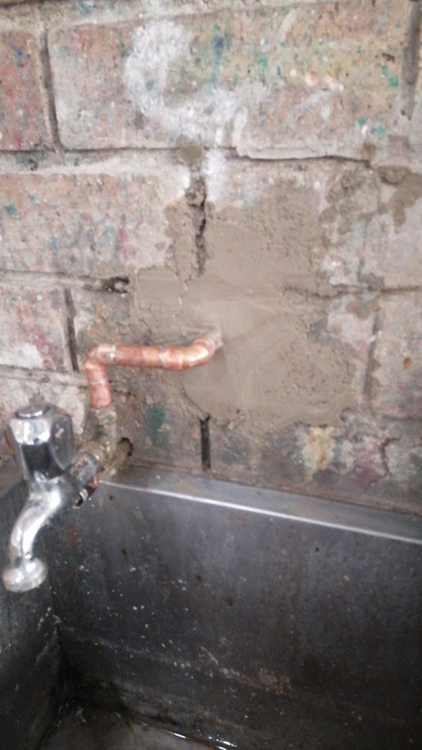 Water damage on wall from burst pipe in Dan Pienaarville