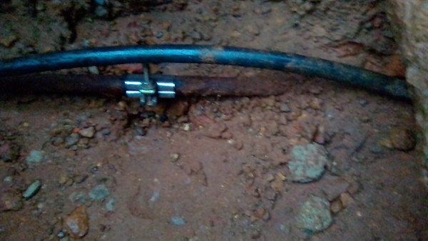 Soggy ground from burst underground pipe in Pinegowrie