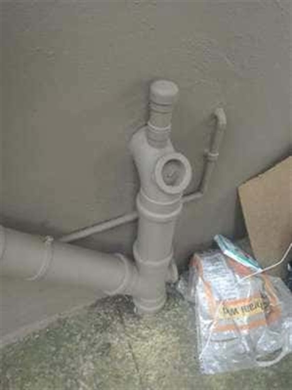 Sewer pipe with waste backing up due to blockage in Claremont