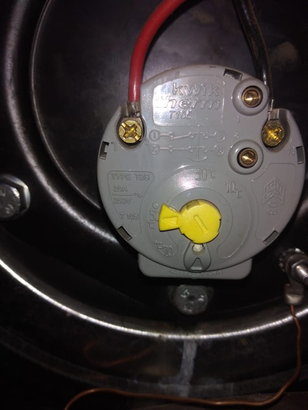 Technician repairing open geyser element and thermostat in Alberton Central with exposed wiring and heating components