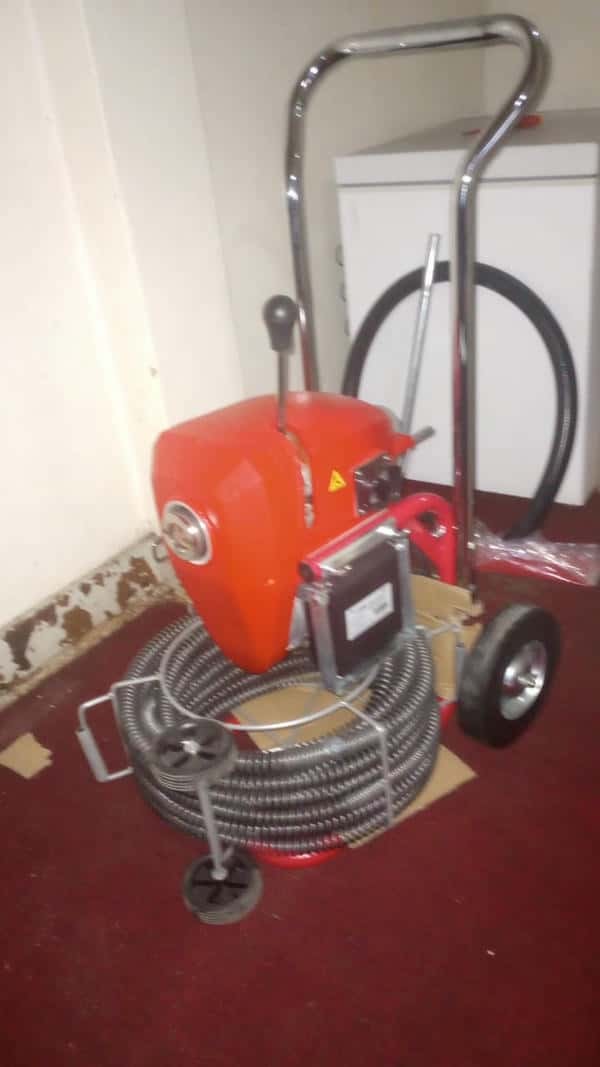 Fully blocked drain filled with water that refuses to flow away