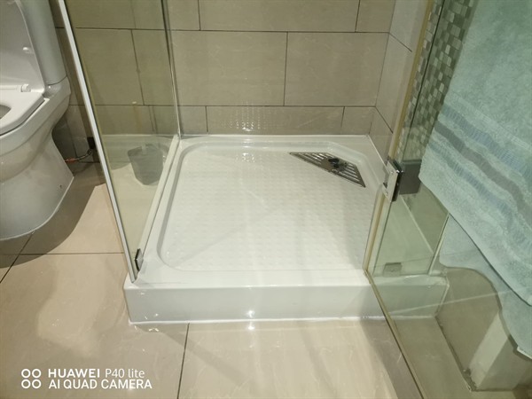 Shower drain with standing water due to blockage in Witkleigat