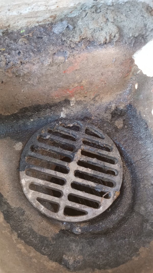 Blocked drain pipe being prepared for full unblocking