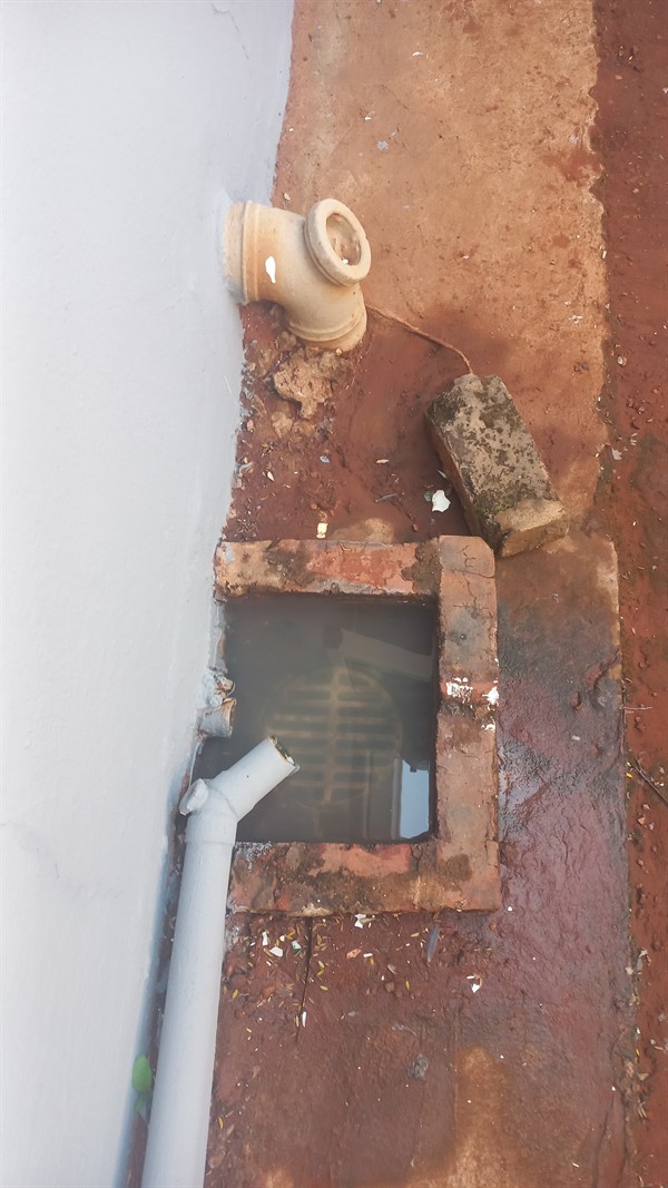 Persistent drain clog being addressed during cleaning