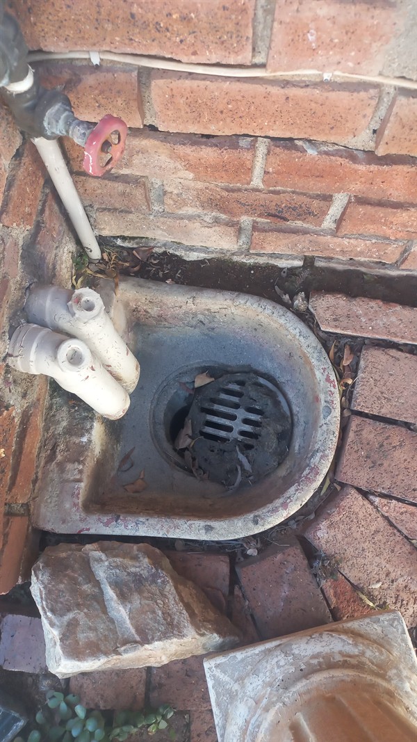 Grease build-up visible inside blocked drain pipe
