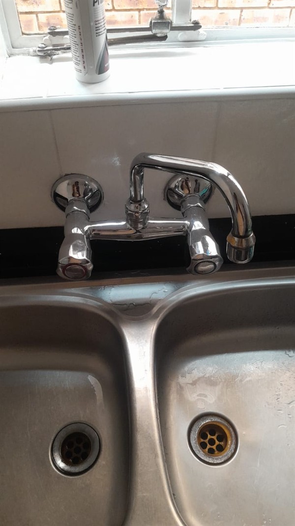 Technician repairing open geyser element and thermostat in Bruma with exposed wiring and heating components