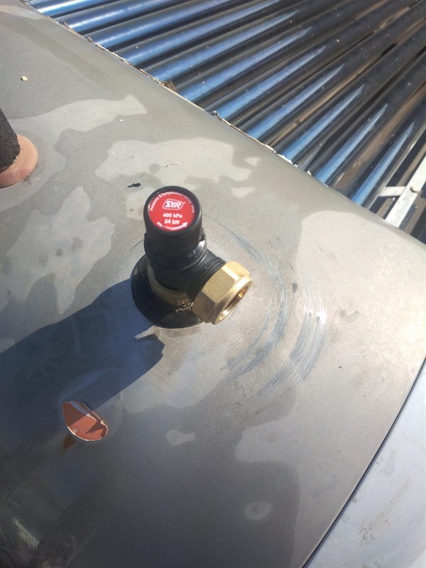 Technician repairing open geyser element and thermostat in Croydon with exposed wiring and heating components