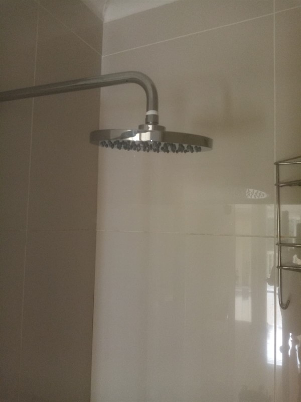 Open hot water geyser during thermostat and element repair in Khyber Rock with internal components visible