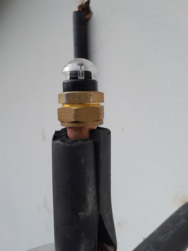 Technician repairing open geyser element and thermostat in Hartzenbergfontein with exposed wiring and heating components