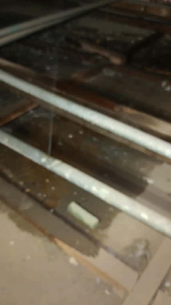 Water damage on ceiling from burst pipe leak in Meadowhurst