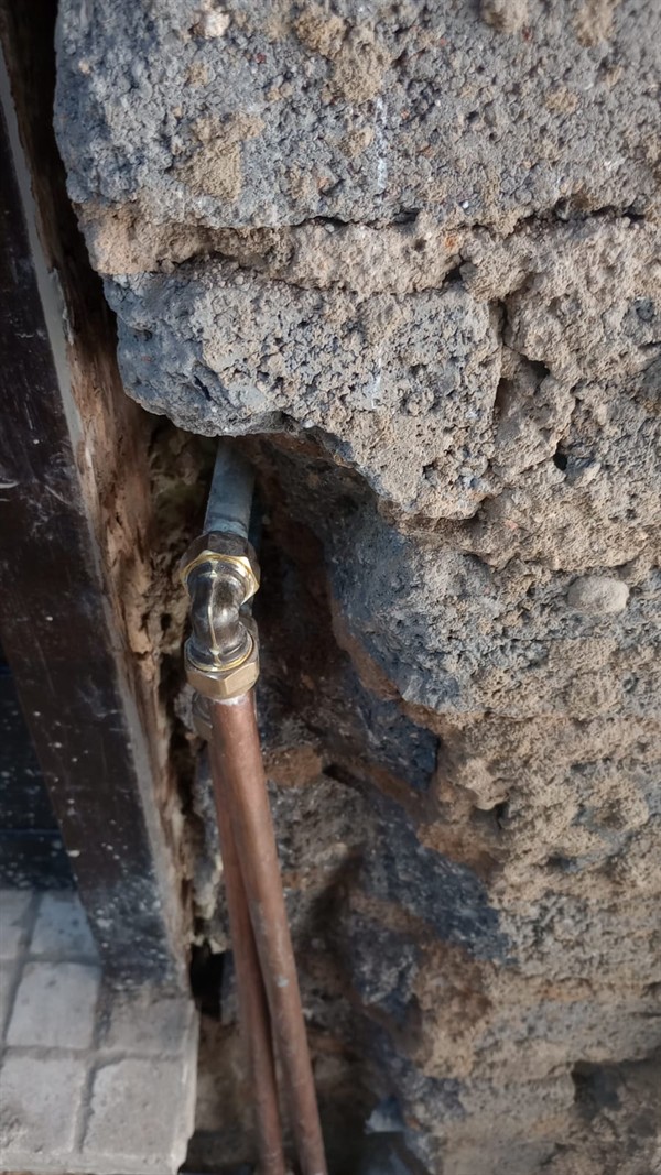 Water seeping from inside wall from burst pipe in Voelfontein