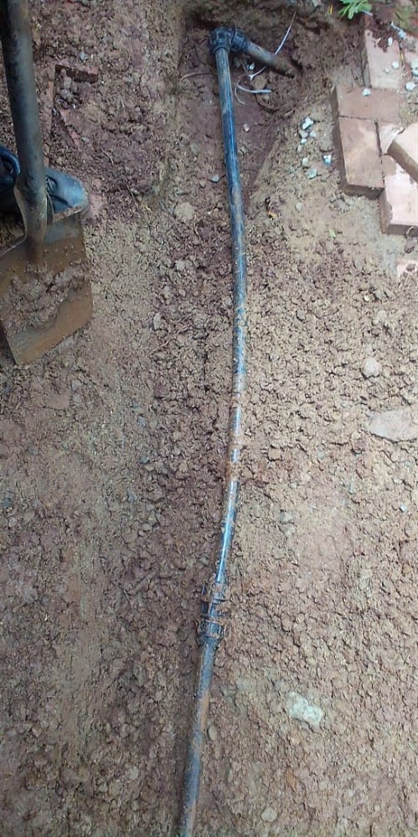 Unexplained wet spots from burst underground pipe in Queenshaven