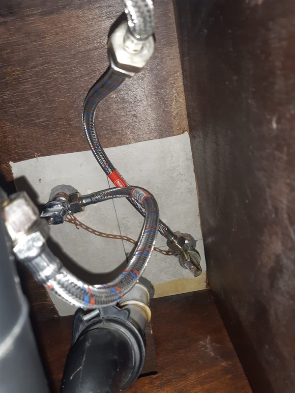 Wet floor behind toilet from leaking flexi pipe in Fairy Glen Hill