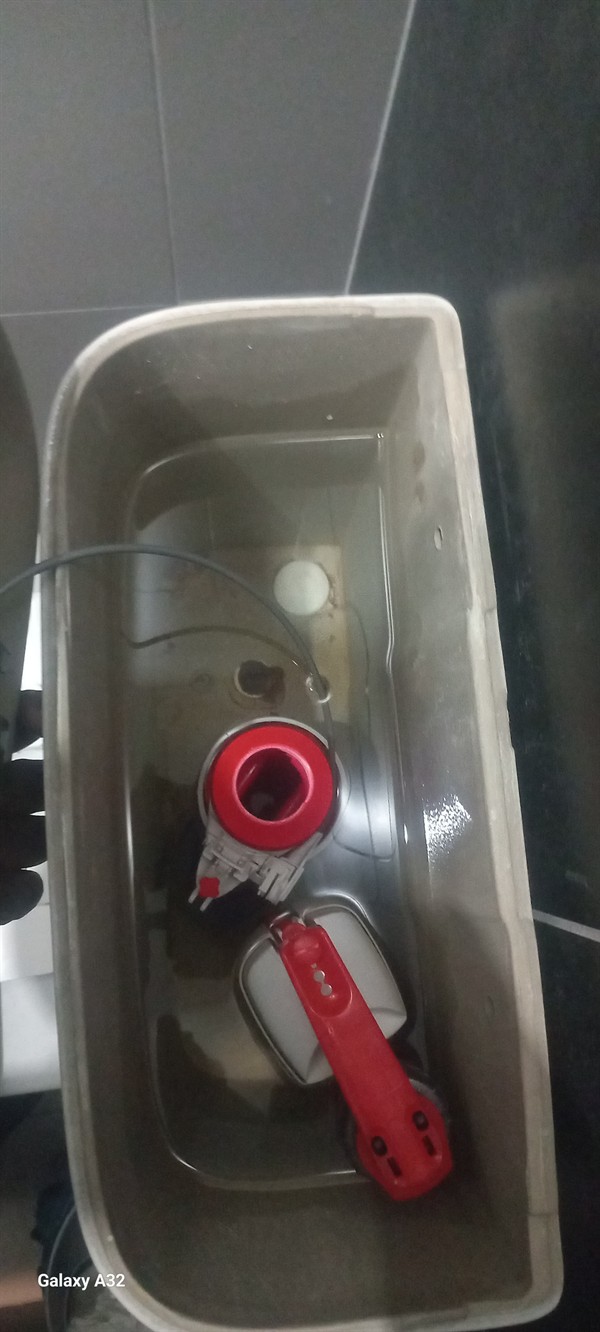 Technician repairing open geyser element and thermostat in Erasmus Village with exposed wiring and heating components