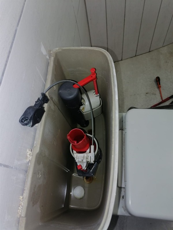 Technician repairing open geyser element and thermostat in Groblerpark with exposed wiring and heating components