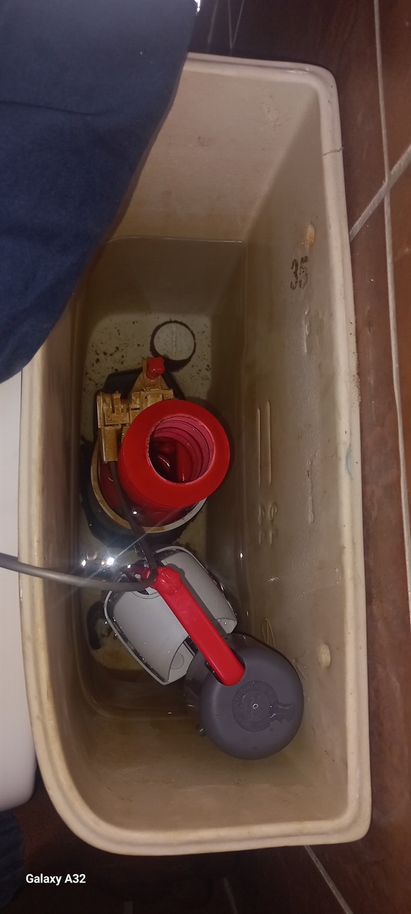 Open geyser showing heating element and thermostat repair work in Roodepoort Central with exposed wiring and internal components