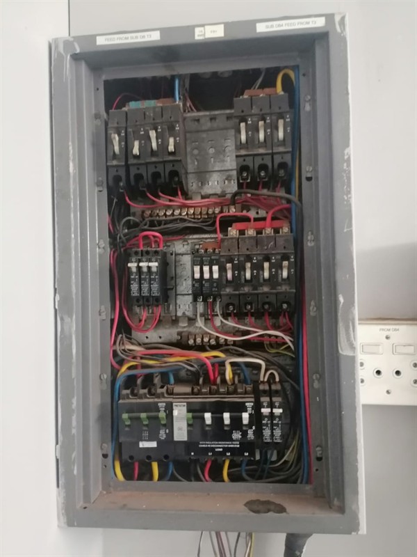 Open geyser showing heating element and thermostat repair work in Bromhof with exposed wiring and internal components
