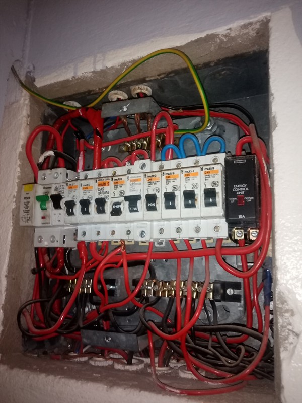 Open hot water geyser during thermostat and element repair in Freeway Park with internal components visible