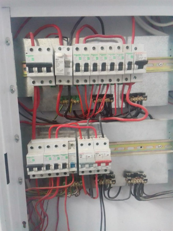 Open hot water geyser during thermostat and element repair in Morganridge with internal components visible