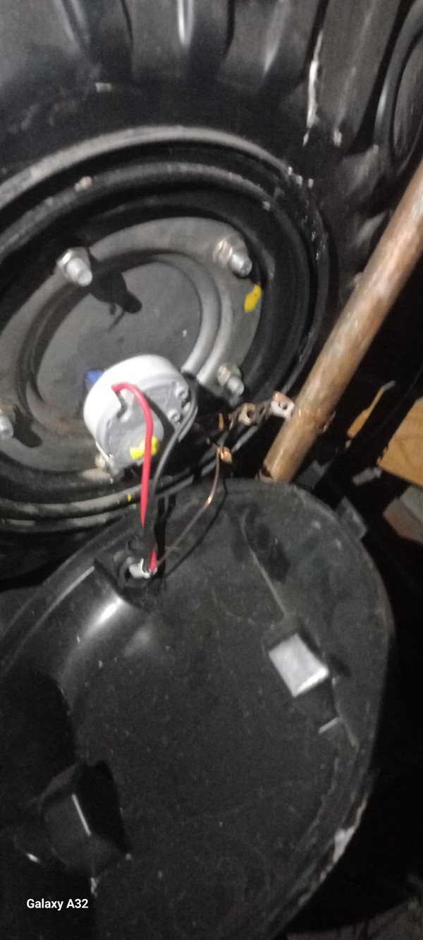 Ceiling mounted geyser opened during element and thermostat repair in Berton Park showing internal wiring