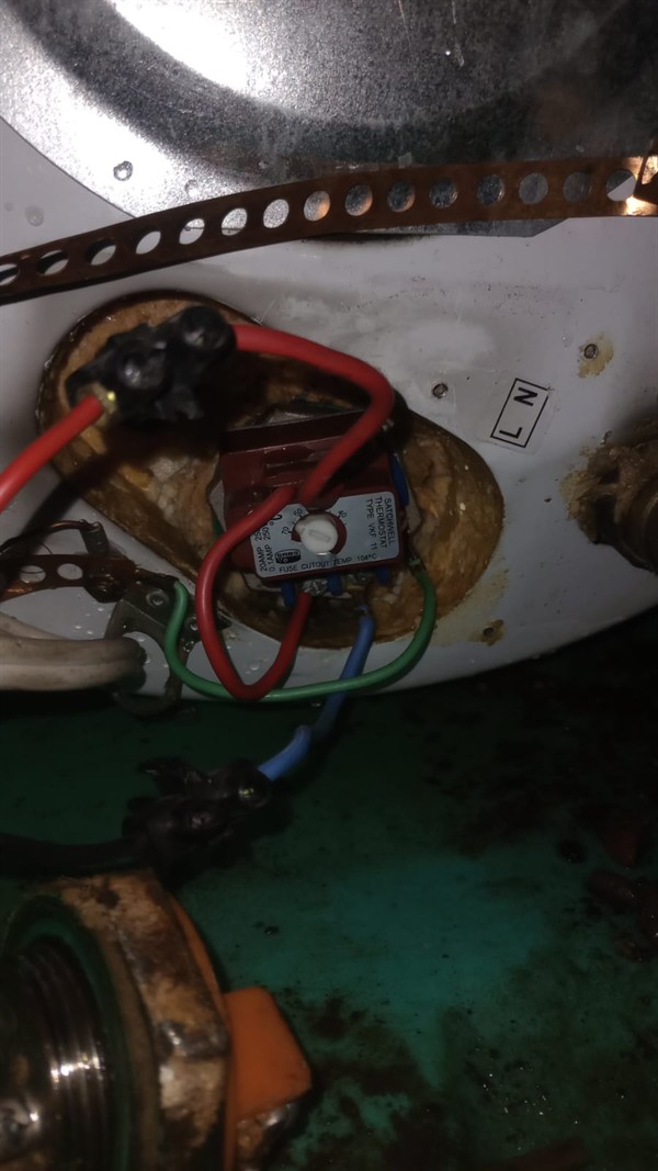 Ceiling mounted geyser opened during element and thermostat repair in Boksburg West showing internal wiring