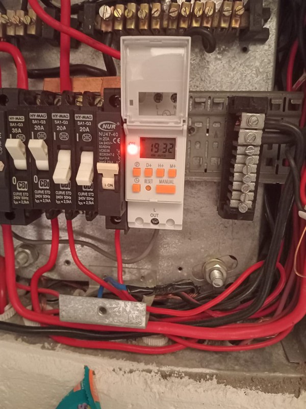 Open hot water geyser during thermostat and element repair in Bryanston Country Club with internal components visible