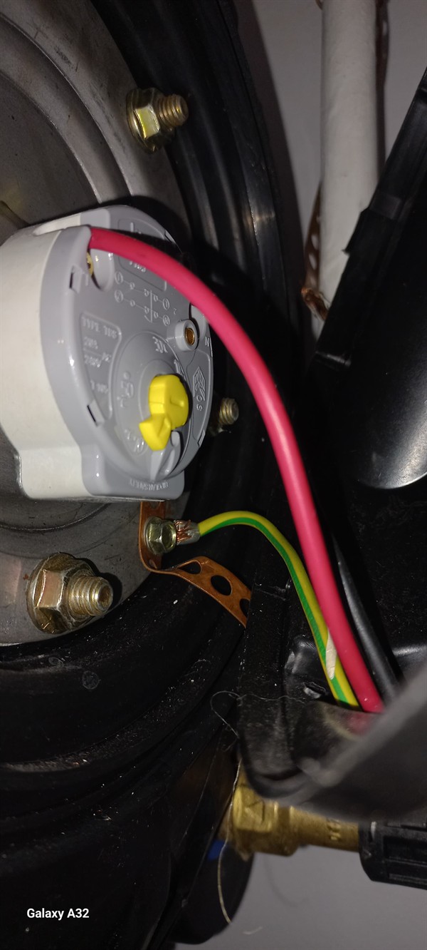 Open hot water geyser during thermostat and element repair in Boksburg South with internal components visible