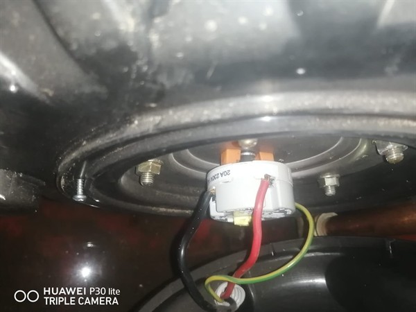 Technician repairing open geyser element and thermostat in Boksburg East with exposed wiring and heating components