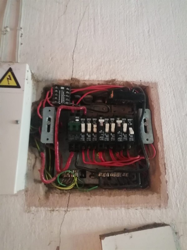 Open hot water geyser during thermostat and element repair in Onderstepoort Landbouhoewes with internal components visible