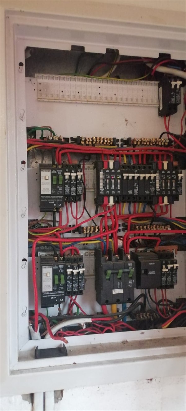Open hot water geyser during thermostat and element repair in Parkrand with internal components visible