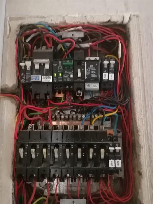 Technician repairing open geyser element and thermostat in Rosedene with exposed wiring and heating components