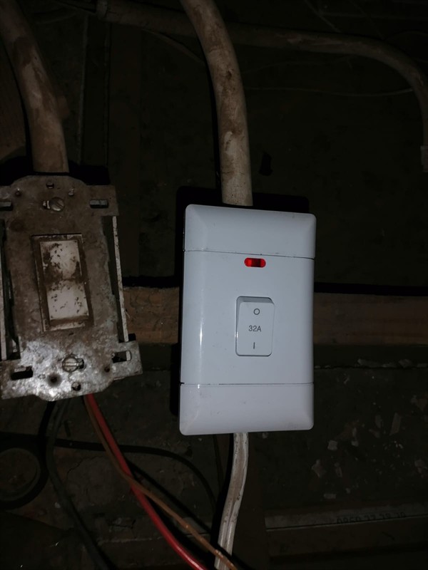 Open hot water geyser during thermostat and element repair in Clubview East with internal components visible