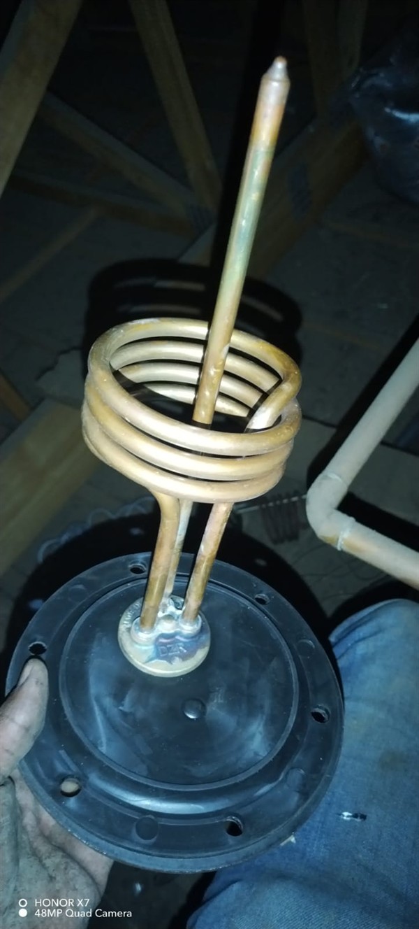 Open geyser showing heating element and thermostat repair work in Dawn Park with exposed wiring and internal components