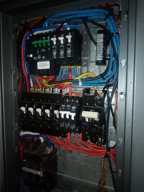 Open geyser showing heating element and thermostat repair work in East Rand with exposed wiring and internal components