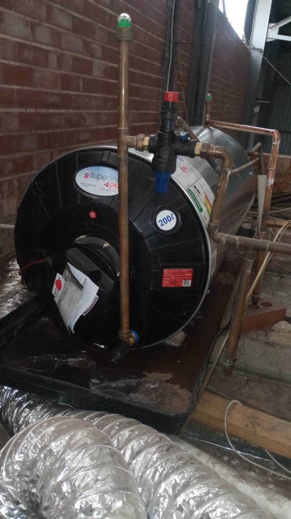Badly flooding cupboard from burst geyser in Grasland