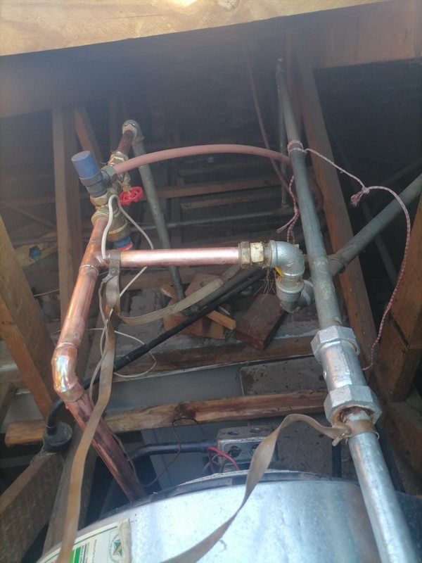 Badly flooding cupboard from burst geyser in Hartbeeshoek