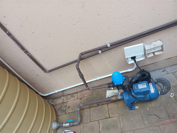 Ceiling mounted geyser opened during element and thermostat repair in Midstream Estate showing internal wiring