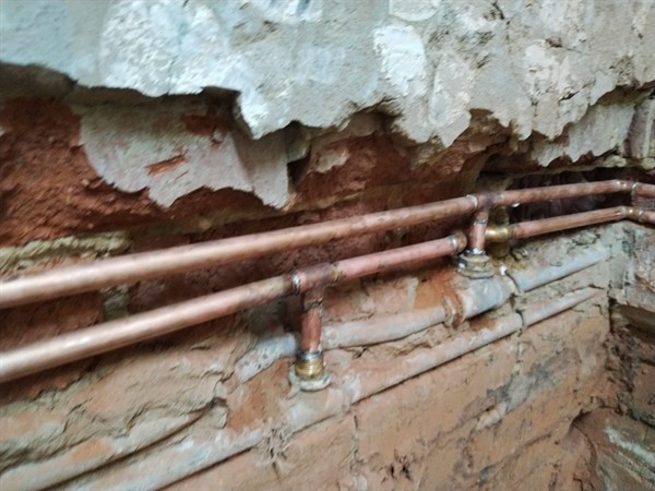 Wall leaking from burst pipe with visible stains in Kempton Park
