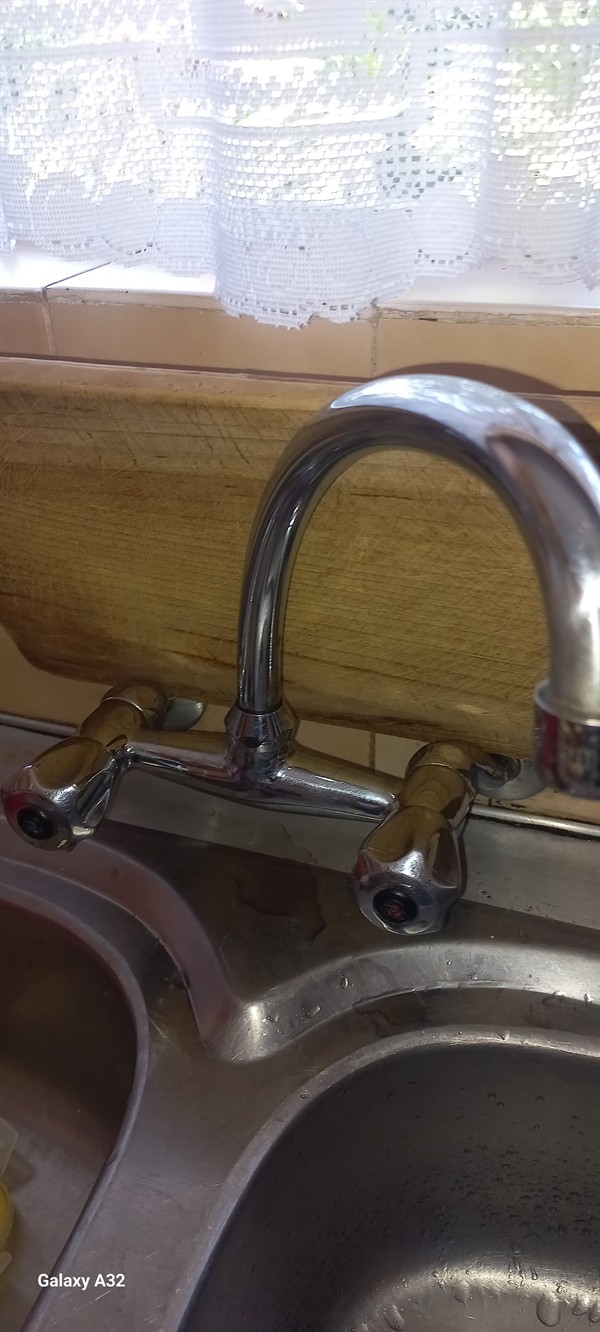 Open geyser showing heating element and thermostat repair work in Equestria Estates with exposed wiring and internal components