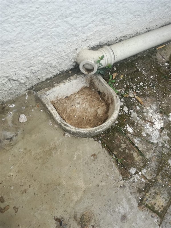 Grease build-up visible inside blocked drain pipe
