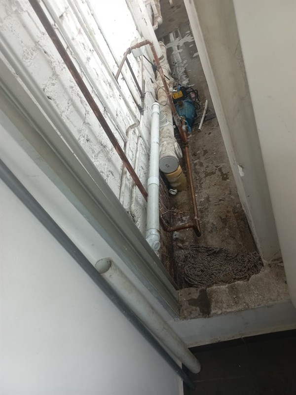 Gushing and soaked ground from burst outside pipe in Kyalami Estate