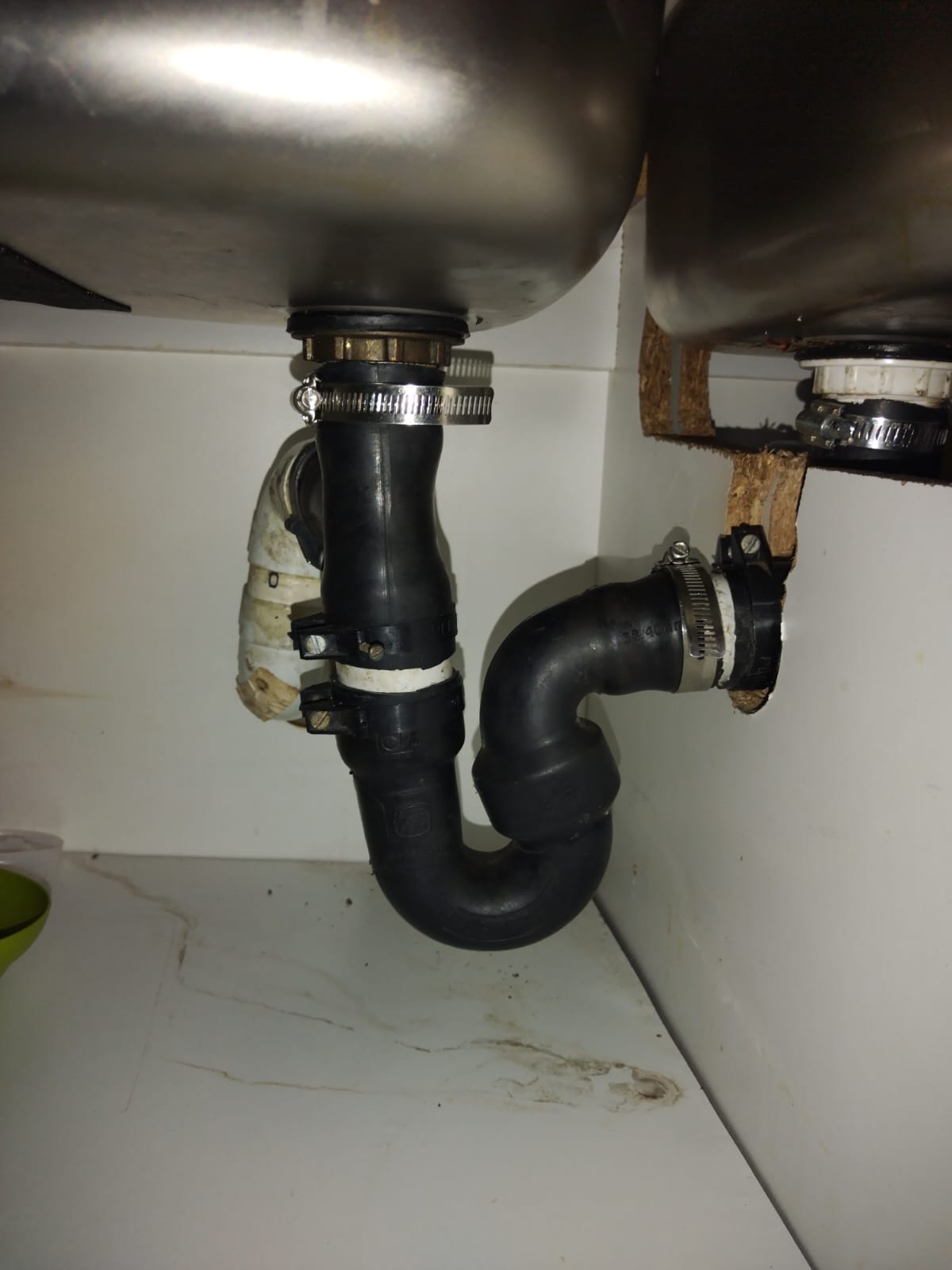 Leaking kitchen sink P-trap in Northcliff causing water pooling inside cabinet before faulty drain trap was replaced and proper drainage restored