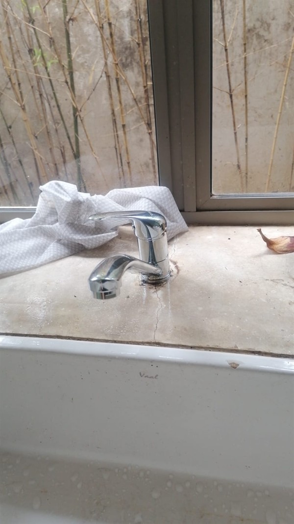 Ceiling mounted geyser opened during element and thermostat repair in Fairview showing internal wiring