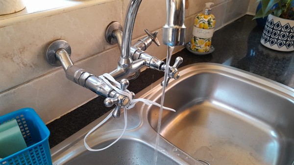 Open geyser showing heating element and thermostat repair work in Rooiwal with exposed wiring and internal components