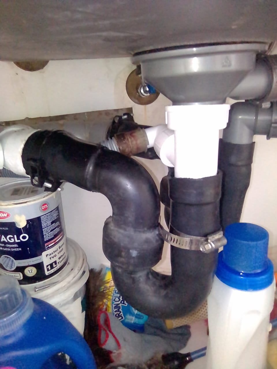 Leaking P-trap under sink repaired in Blairgowrie, showing under-basin drainage pipe and connections after fixing leak and restoring proper water flow.