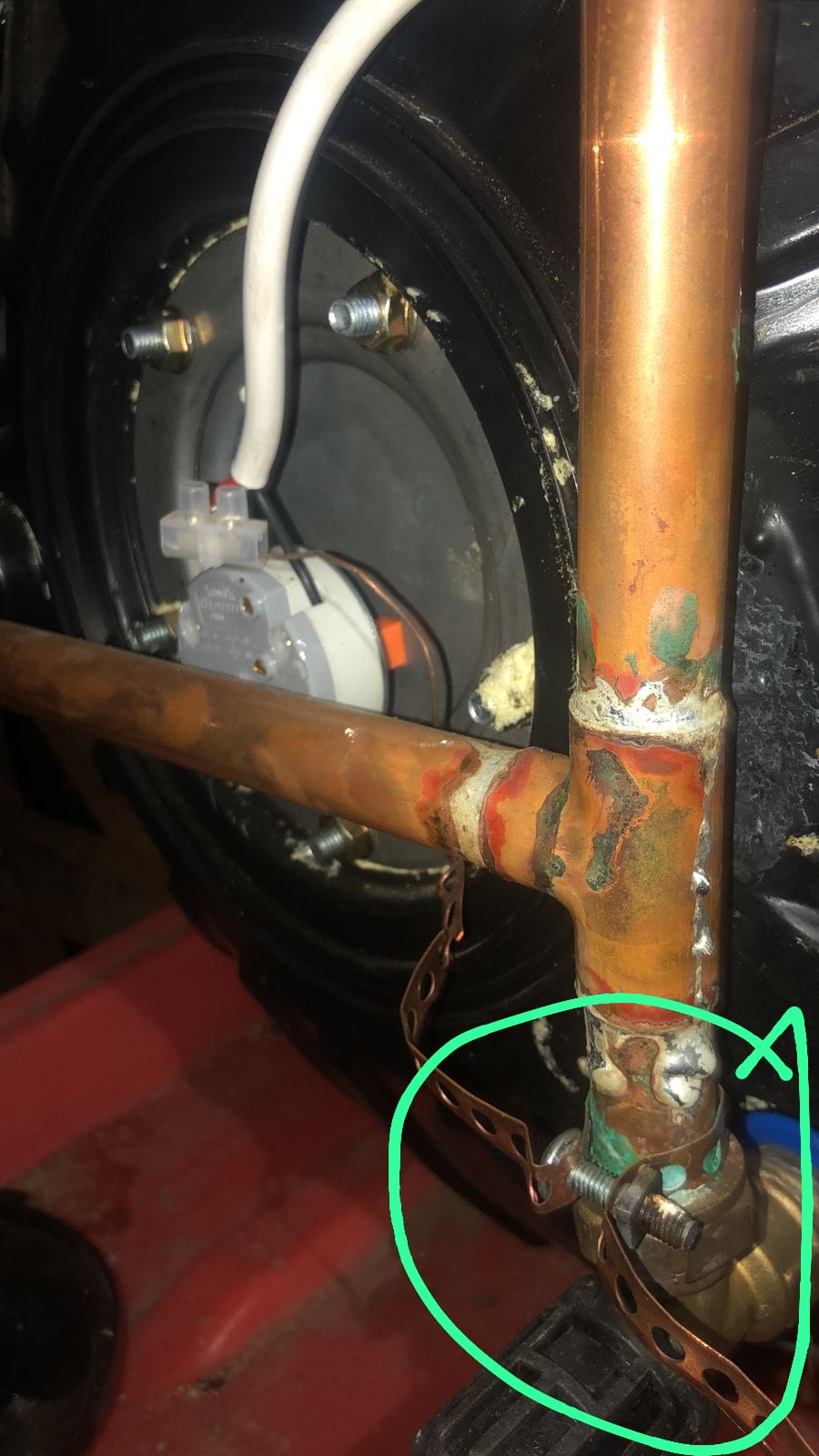 Leaking pipe at geyser repaired in Ferndale, showing geyser plumbing connections after fixing water leak and restoring proper hot water supply.